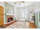 Charming bedroom with decorative fireplace, statement mirror and a cozy canopy bed at 987 Lena Nw St, Atlanta, GA 30314