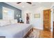 Comfortable bedroom featuring a ceiling fan, natural light, and an adjoining closet at 987 Lena Nw St, Atlanta, GA 30314