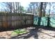 Backyard featuring wood and mesh fencing, with sparse grass at 343 Kate Dr, Forest Park, GA 30297
