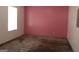 Unfinished basement featuring pink walls, concrete floors, and a window at 343 Kate Dr, Forest Park, GA 30297