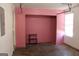 Unfinished basement featuring pink walls, concrete floors, and a window at 343 Kate Dr, Forest Park, GA 30297