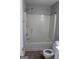 Bathroom featuring a standard toilet and a tub with a shower head at 343 Kate Dr, Forest Park, GA 30297