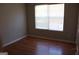 Bedroom featuring hardwood flooring and a window with blinds at 343 Kate Dr, Forest Park, GA 30297