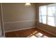 Dining room with hardwood floors, wainscoting, and natural light from the windows at 343 Kate Dr, Forest Park, GA 30297