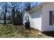 Back of house with dark fence, siding and green lawn at 343 Kate Dr, Forest Park, GA 30297