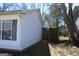 Exterior view with fence, window and light-colored siding at 343 Kate Dr, Forest Park, GA 30297