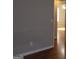 Hallway with hardwood flooring, neutrally painted walls, and an open doorway at 343 Kate Dr, Forest Park, GA 30297