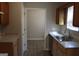Functional kitchen features wood cabinets, ample counter space, and stainless steel sink at 343 Kate Dr, Forest Park, GA 30297