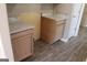 Kitchen featuring marble countertop and wood cabinets and wood flooring at 343 Kate Dr, Forest Park, GA 30297