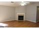 Comfortable living room with a fireplace, hardwood floors, and neutral wall colors at 343 Kate Dr, Forest Park, GA 30297