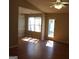 Inviting living room featuring hardwood floors and a ceiling fan with light fixture at 343 Kate Dr, Forest Park, GA 30297
