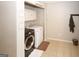 Laundry room features modern appliances and tile flooring at 888 Laney Rd, Locust Grove, GA 30248