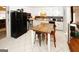 Bright eat-in kitchen features white cabinets, stainless appliances, and tile flooring at 888 Laney Rd, Locust Grove, GA 30248