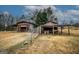 The backyard features two sheds and partial fencing at 888 Laney Rd, Locust Grove, GA 30248