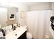 This bathroom features neutral colors, a single-sink vanity, and a shower/tub combo at 888 Laney Rd, Locust Grove, GA 30248