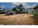 The backyard features a shed, a grassy yard, and partial fencing at 888 Laney Rd, Locust Grove, GA 30248