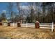 Long white fence with decorative posts lining the property's front yard at 888 Laney Rd, Locust Grove, GA 30248