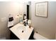 This bathroom features neutral colors, a single-sink vanity, and bronze fixtures at 888 Laney Rd, Locust Grove, GA 30248