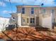 Backyard view features a back patio and fenced area at 11403 South Grove Dr, Hampton, GA 30228