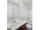 Bathroom features a white vanity, a large mirror, a bathtub with a shower, and a toilet at 11403 South Grove Dr, Hampton, GA 30228