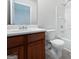 Cozy bathroom featuring a vanity with dark wood cabinets and a shower-tub combo at 11403 South Grove Dr, Hampton, GA 30228