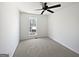 Bedroom featuring neutral walls, plush carpeting and window providing natural light, offering a cozy retreat at 11403 South Grove Dr, Hampton, GA 30228