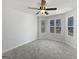 Bright bedroom boasts neutral walls, new flooring, a ceiling fan, and plentiful natural light at 11403 South Grove Dr, Hampton, GA 30228
