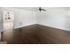Spacious room with luxury vinyl plank flooring, lots of natural light and a fan that enhances the inviting atmosphere at 11403 South Grove Dr, Hampton, GA 30228