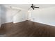 Bright living area with luxury vinyl plank flooring, a ceiling fan, staircase and easy access to other areas of the home at 11403 South Grove Dr, Hampton, GA 30228