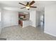 Open living area combining kitchen and dining, filled with natural light at 11403 South Grove Dr, Hampton, GA 30228