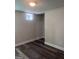 Finished basement area with wood-look flooring and white trim at 1066 Ashby Sw Grv, Atlanta, GA 30314