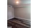 Finished basement area with wood-look flooring and white trim at 1066 Ashby Sw Grv, Atlanta, GA 30314
