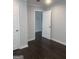 This room features a dark hardwood floor, light gray walls, white trim and doors, and recessed lighting at 1066 Ashby Sw Grv, Atlanta, GA 30314