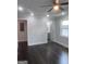 A spacious bedroom features hardwood floors, recessed lighting, and two windows at 1066 Ashby Sw Grv, Atlanta, GA 30314
