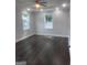 A spacious bedroom features hardwood floors, recessed lighting, and two windows at 1066 Ashby Sw Grv, Atlanta, GA 30314