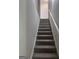 A staircase with gray carpet and white painted trim at 1066 Ashby Sw Grv, Atlanta, GA 30314