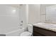 Bright bathroom featuring a tub and shower combination, modern fixtures, cabinet with sink and toilet at 11192 Cornerstone Way, Hampton, GA 30228
