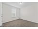 Bedroom featuring neutral carpet, white trim and walls, closet and natural light at 11192 Cornerstone Way, Hampton, GA 30228