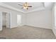 Spacious main bedroom with trey ceiling, ceiling fan, carpet, and walk-in closet at 11192 Cornerstone Way, Hampton, GA 30228