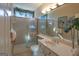 Bright bathroom featuring a glass shower, vanity, and decorative accents at 168 Maple Grove Ter, Peachtree City, GA 30269