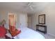 Bright bedroom with a ceiling fan, and a bed with a teddy bear, providing a relaxing and inviting atmosphere at 168 Maple Grove Ter, Peachtree City, GA 30269