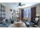 Eclectic bedroom featuring unique decor, comfortable seating, and window with natural light at 168 Maple Grove Ter, Peachtree City, GA 30269