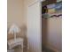 A bedroom closet with assorted items on a wire shelf and colorful hangers at 168 Maple Grove Ter, Peachtree City, GA 30269
