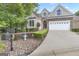 Beautiful home showcasing lush landscaping, an attached two car garage, and mailbox at street's edge at 168 Maple Grove Ter, Peachtree City, GA 30269