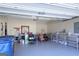 View of the interior of the home's garage with shelving, open garage door, and gear at 168 Maple Grove Ter, Peachtree City, GA 30269