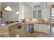 Bright kitchen featuring granite countertops, white cabinetry, and stainless steel appliances at 168 Maple Grove Ter, Peachtree City, GA 30269