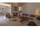 Bright living room features a fireplace, modern decor, and large windows at 168 Maple Grove Ter, Peachtree City, GA 30269