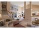 Open concept living area with stairs, fireplace, and adjacent breakfast nook at 168 Maple Grove Ter, Peachtree City, GA 30269