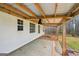Back porch features wood beam ceiling at 521 Cody Ln, Mcdonough, GA 30252