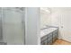 Ensuite bathroom featuring a shower, double sinks and tile flooring at 521 Cody Ln, Mcdonough, GA 30252